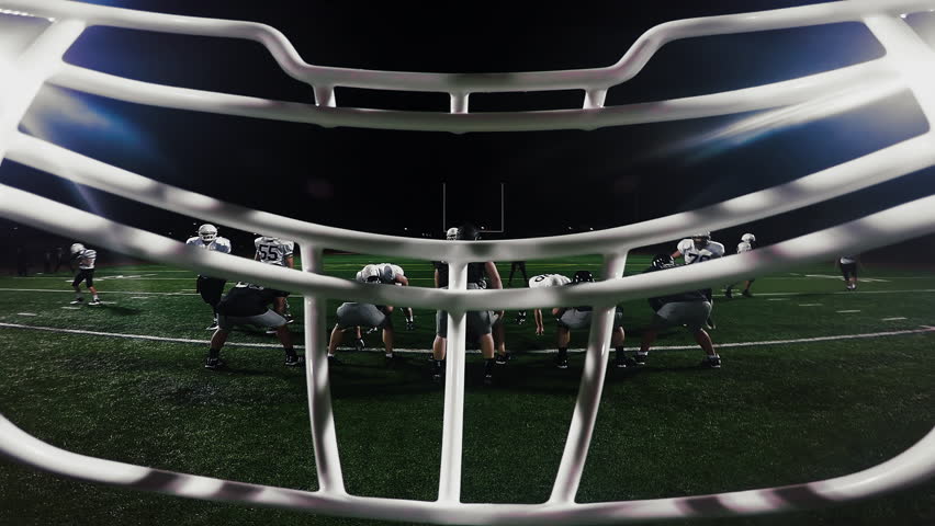 A Football Player Calls His Teammates Into A Huddle Stock Footage Video 