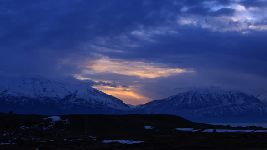 high-definition-time-lapse-of-a-sunrise-over-the-mountains-stock