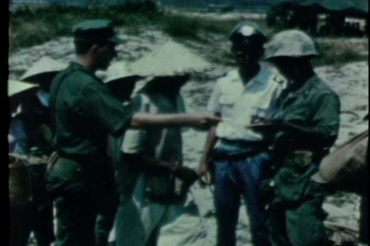 1960s U S Military Doctors Treat Vietnamese Refugees During The Vietnam War Stock Footage 