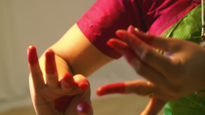 a-lovely-young-woman-using-traditional-mudra-or-hand-gestures-to-tell-a