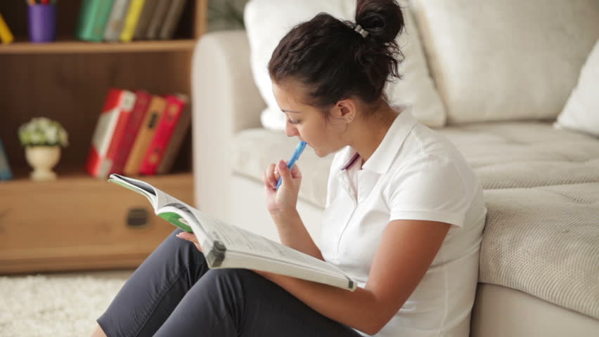 Girl Sitting On Floor In Living Room Girl Sitting On Floor In Living Room