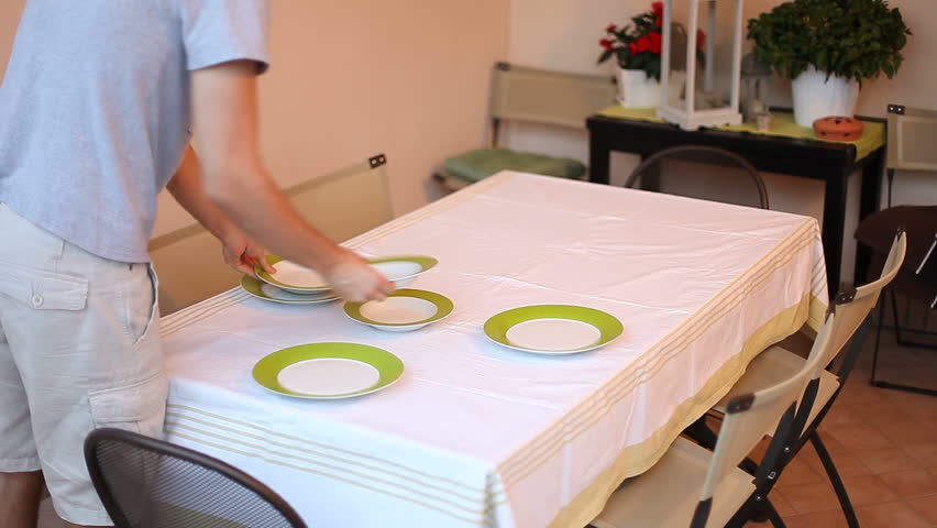 man-laying-serve-dishes-on-the-table-stock-footage-video-5322158