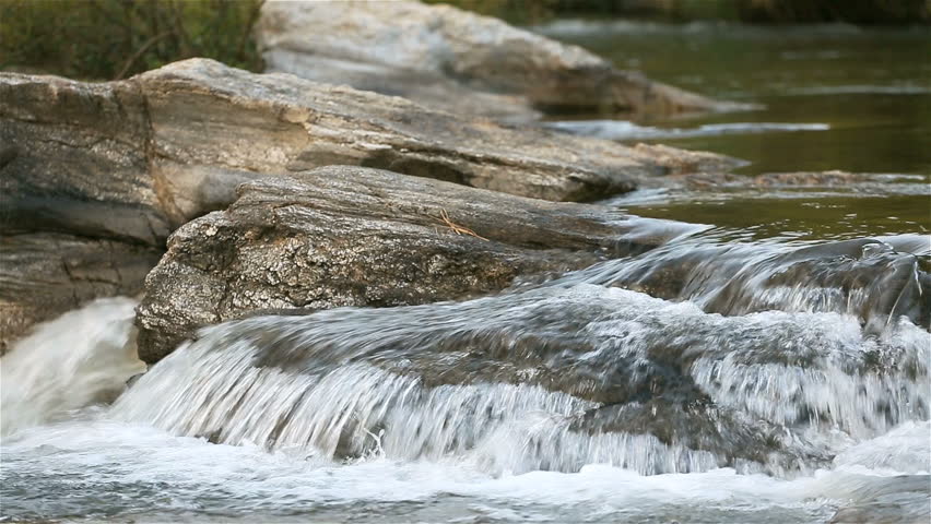 water-stream-running-over-the-rocks-in-the-fores-stock-footage-video