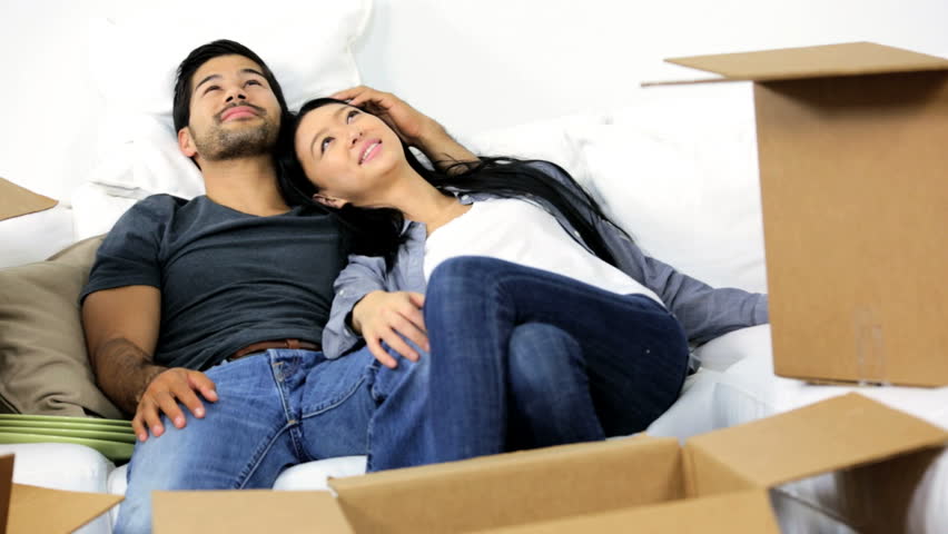 Happy Exhausted Young Loving Asian Chinese Couple Surrounded Home