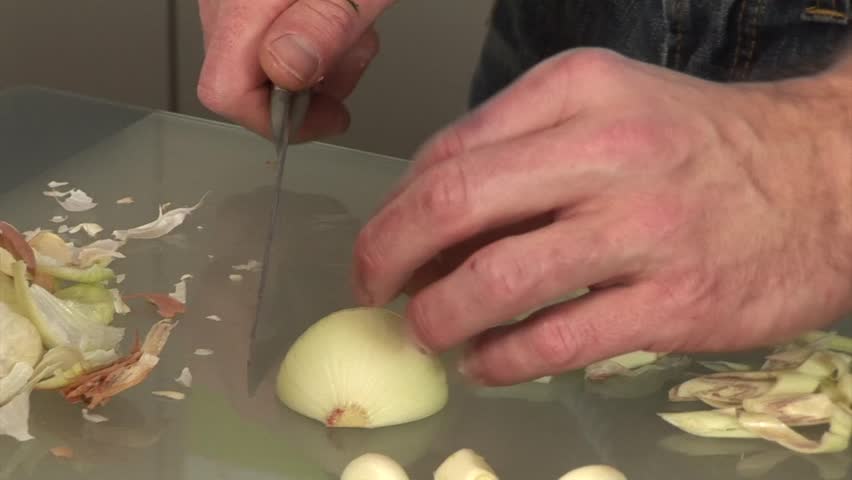 Cook Cutting Onions With Sharp Knife For Vegetables In The