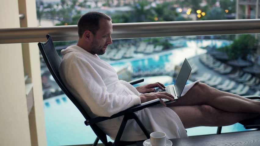 Attractive Man With Laptop On Hotel Or Apartment Balcony Stock Footage Video 7606324 Shutterstock