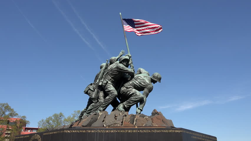 NTSC: Iwo Jima Memorial - Tilt Up Close Of Hands Holding The US Flag ...