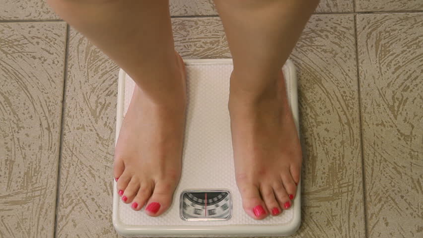 Woman On Weight Scale Sequence (HD). Sequence Of Shots Of Female Legs ...