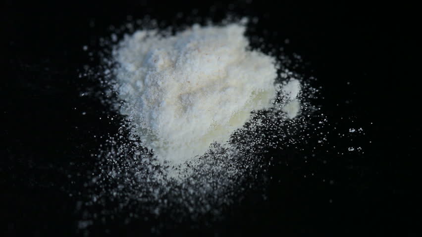 Cocaine Being Prepared With A Razor Against A Black Background Stock ...