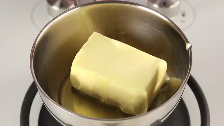 A Large Piece Of Butter Melting In A Pot Stock Footage Video 3154591 ...