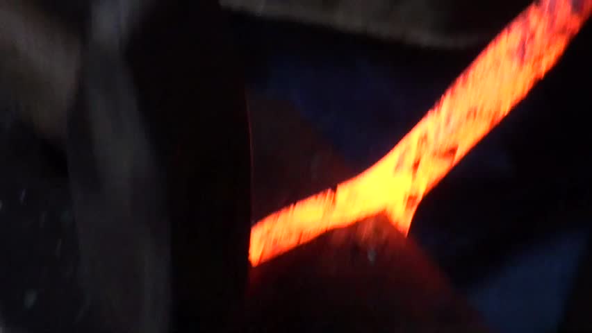 Blacksmith Is Hammering A Red-hot Piece Of Iron Stock Footage Video ...