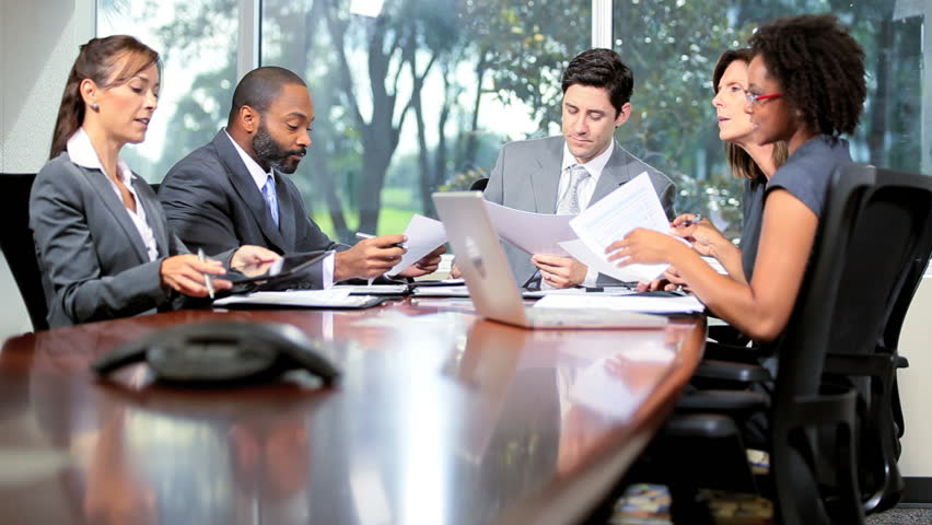 Young Male Caucasian Team Leader Chairing Boardroom Meeting Multi ...