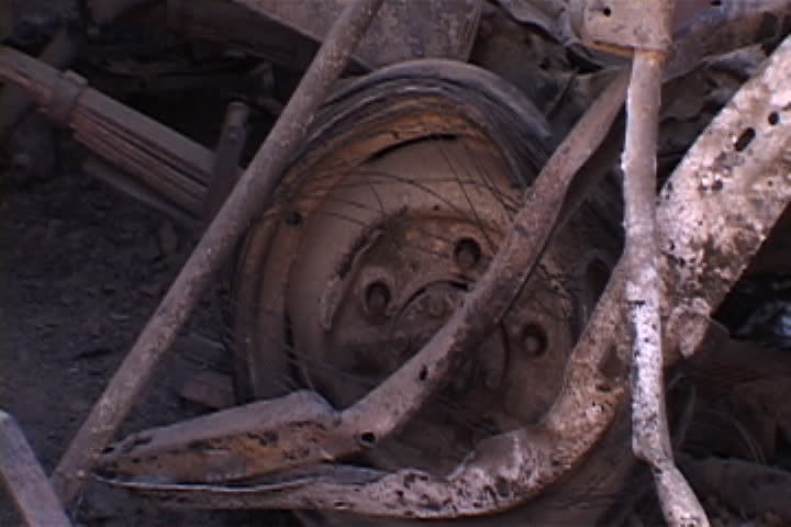 Rusted Wheel And Metal Debris At Bombed Building Site In Baghdad, Iraq ...