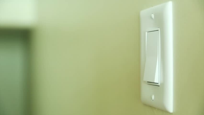 A Hand Turning On And Off A Light Switch In A House Stock Footage Video ...