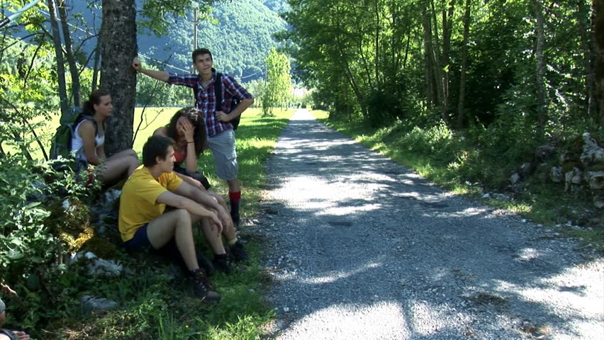 Youngsters Stop For A Rest Under The Tree Besides The Footpath Stock ...