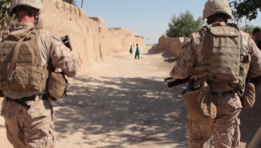 Afghanistan, Circa 2011: US Marines Carrying Weapons Walk Down Dirt ...