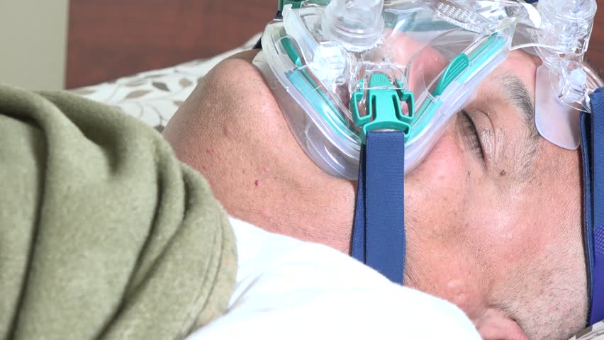 Obese Hispanic Man Suffering From Sleep Apnea. Person Wearing The CPAP ...