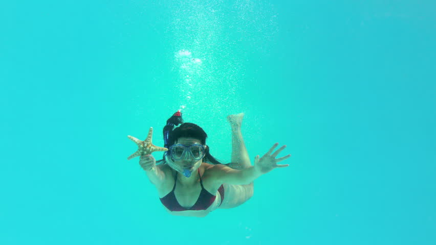 Fit Brunette Diving Into Swimming Pool Wearing Snorkel On Her Holidays ...