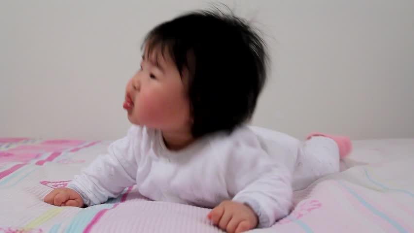 Cute Asian Baby Infant Girl Posing like a lion - HD stock video clip