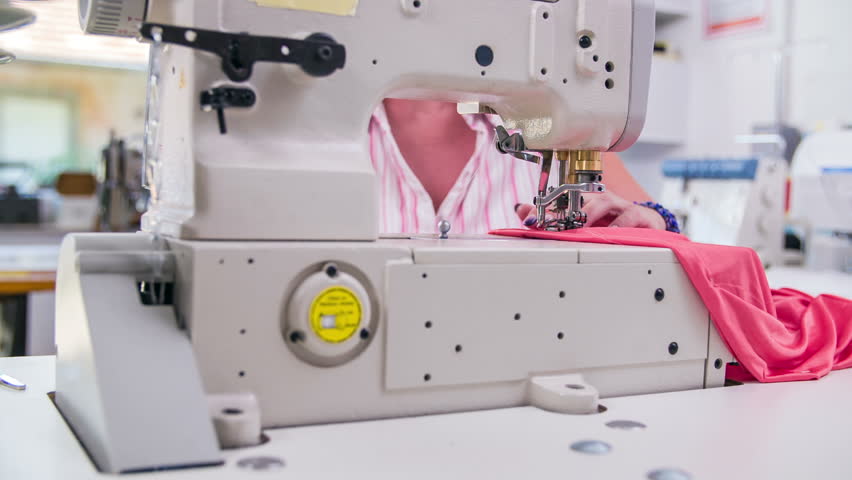 Professional Sewing Machine With Female Tailor Working. Slow Motion ...