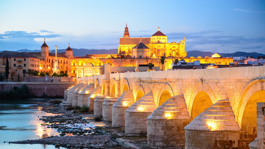 Cordoba, Spain Town Skyline At The Roman Bridge And Mosque-Cathedral ...