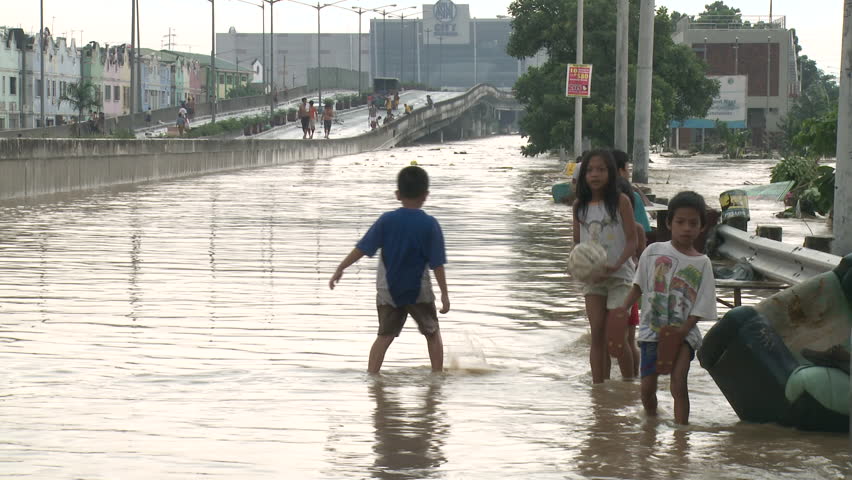 MANILA, PHILIPPINES - AUG 2012: Street Kids Walk Through Filthy Flood ...